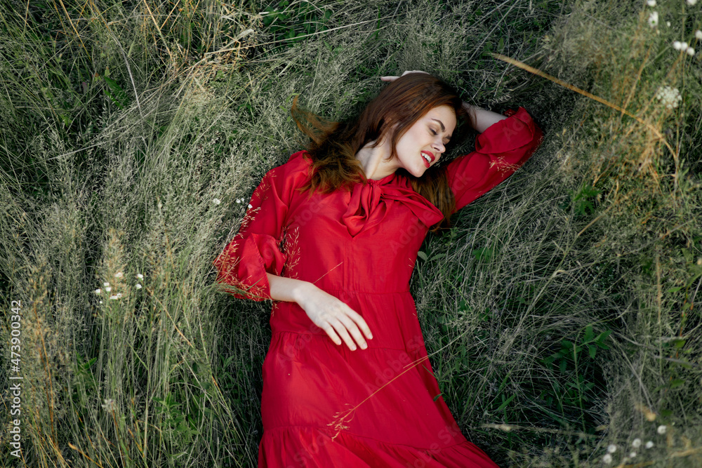 woman in red dress nature green grass landscape rest woman in red dress nature green grass landscape rest