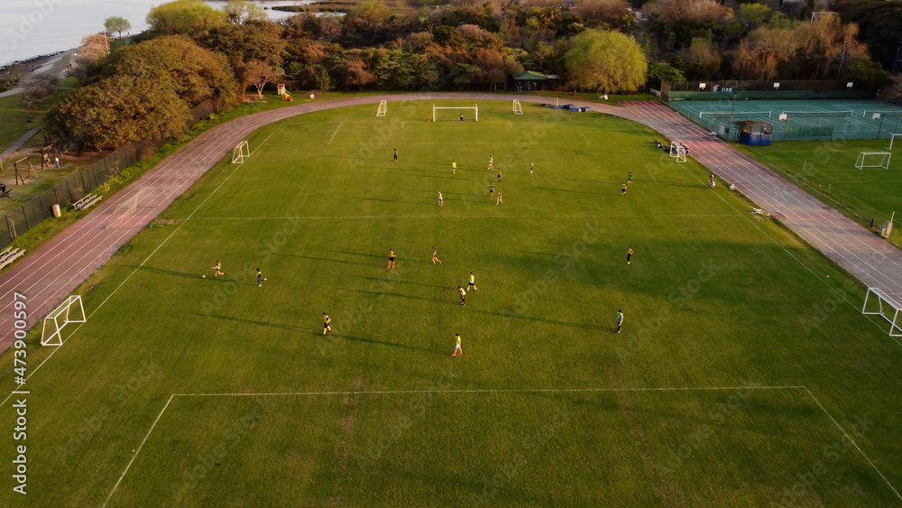 Obraz premium Women playing football match. Aerial shot