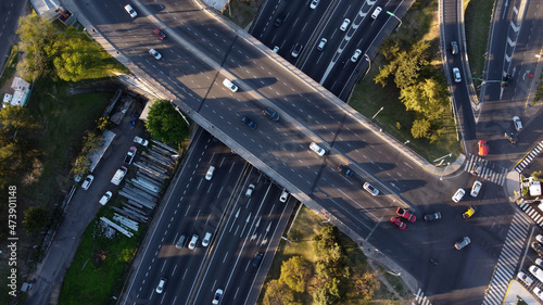 Aerial top down view of vehicular traffic on modern multilevel interstate overpass in Buenos Aires. Argentina. photo