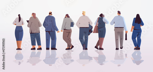 mix race businesspeople team standing back to camera rear view of business people group posing