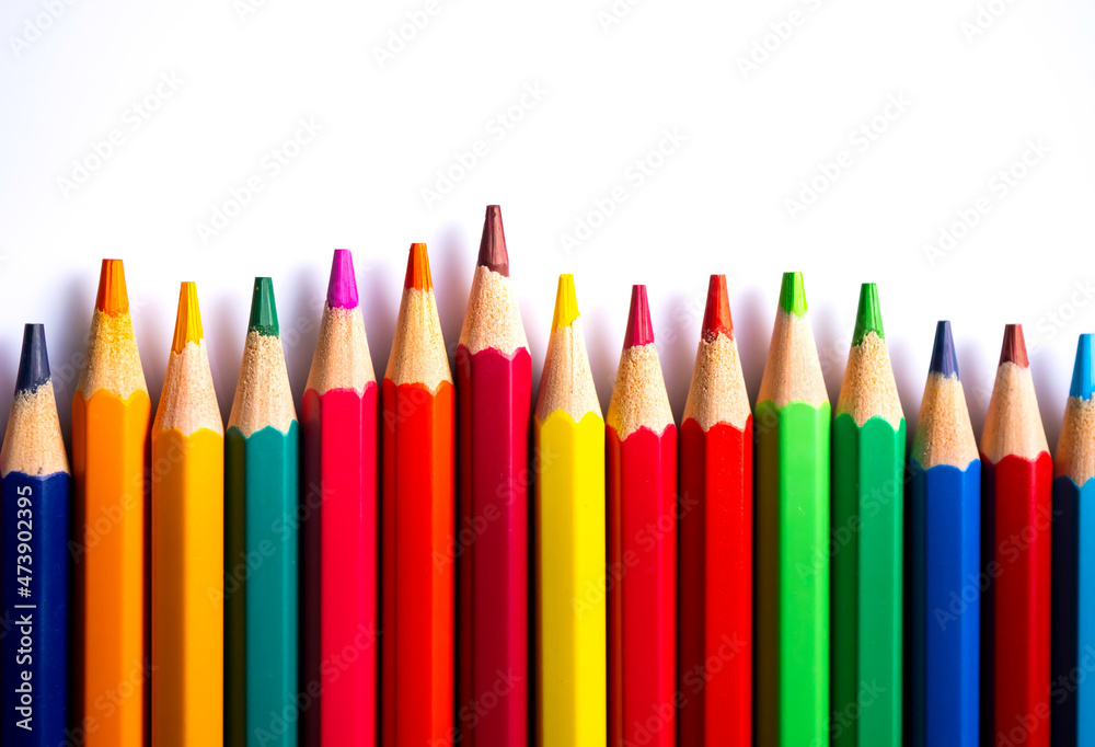 Color pencils on white background.Set of wooden color pencils arranged in bulk with copy space.Photo select focus. Color pencils on white background.Set of wooden color pencils arranged in bulk with copy space.Photo select focus.
