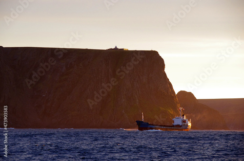 Canvas Print Cargo ship passing Nordkapp, northern norway.