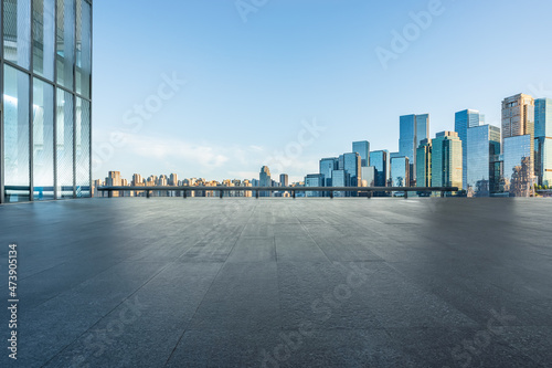 Panoramic skyline and modern commercial office buildings with empty road. empty square floors and cityscape.