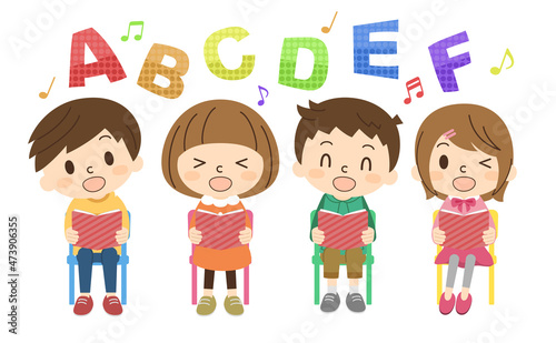 椅子に座って英語の勉強をする子供たち
