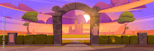 Summer landscape with stone arch entrance to public park at sunset. Vector cartoon illustration of city garden with green hedge, archway portal and town buildings on skyline at evening photo