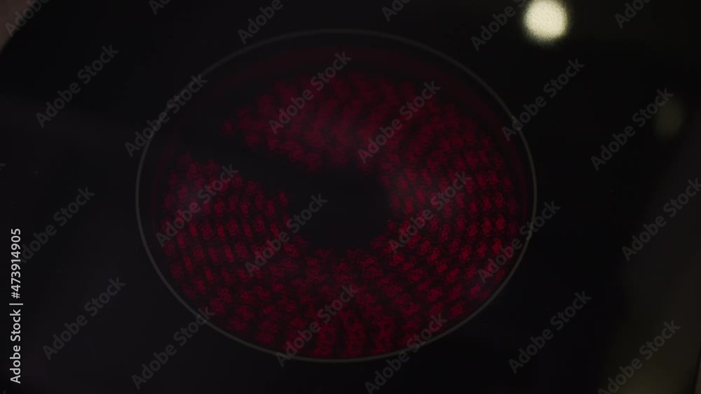 The ring of an induction cooktop, as the heating element turns on and