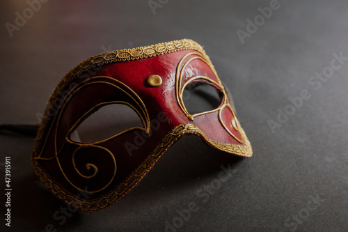 Carnival Venetian black mask on black color background, disguise, masquerade