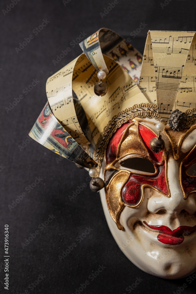 Carnival Venetian harlequin mask on black color background. Traditional  festival disguise. Stock Photo | Adobe Stock