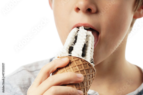 close-up boy eating ice cream isolated on white