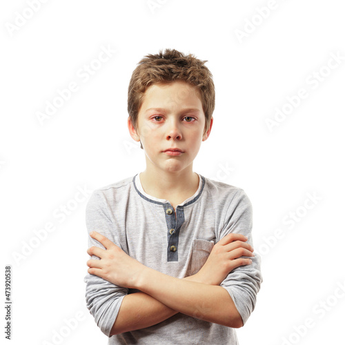 crying sad boy, isolated on white background. beautiful child with red eyes