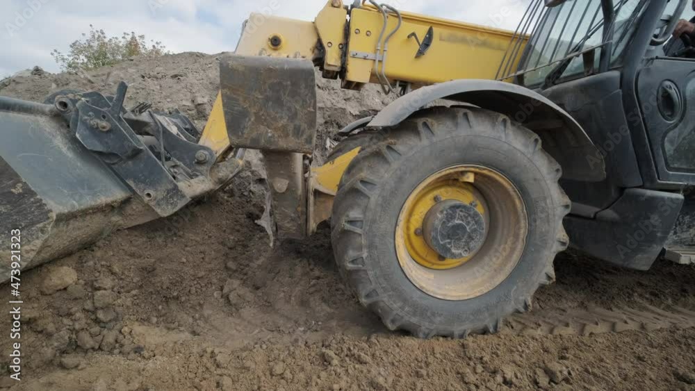 Excavation tractor works, compaction of the soil Excavation tractor works, compaction of the soil