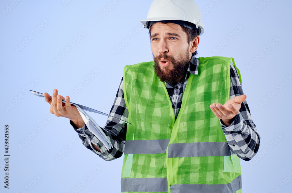 male builder with documents and drawings blueprints studio industry