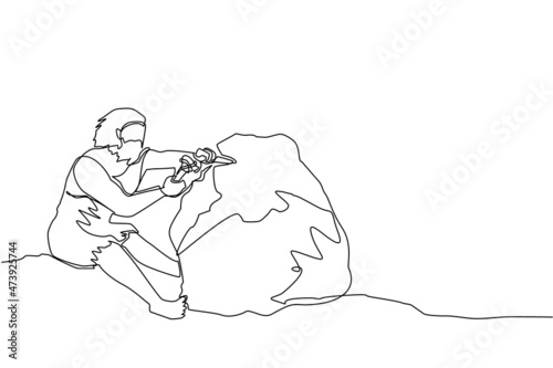 Single one line drawing prehistoric ancient primitive cave tribe man. Wild prehistoric character sitting, writing, carving stone age inscription on rock. Continuous line draw design vector