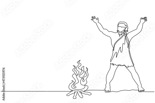 Single continuous line drawing prehistoric man standing around bonfire. Caveman stands and raised two of his hands around campfire. Warmth his body at night. One line draw design vector illustration