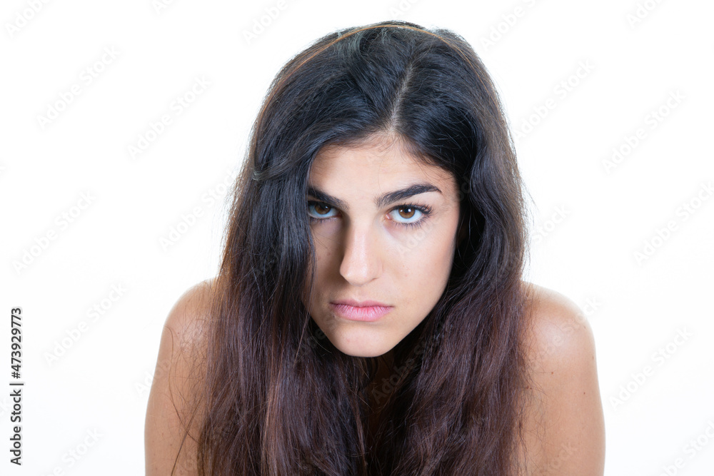 portrait of sad serious young woman posing on isolated background white portrait of sad serious young woman posing on isolated background white