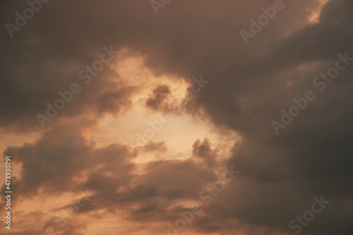 Heaven sky during sunset. Summer sky full of orange sunlight