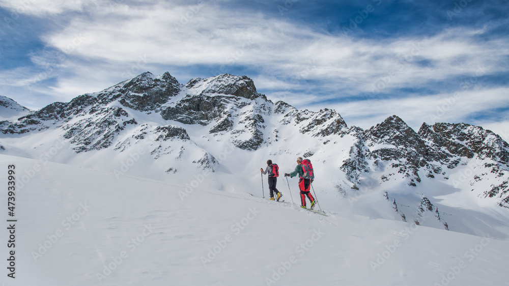 Couple of friends during a ski mountaineering excursion