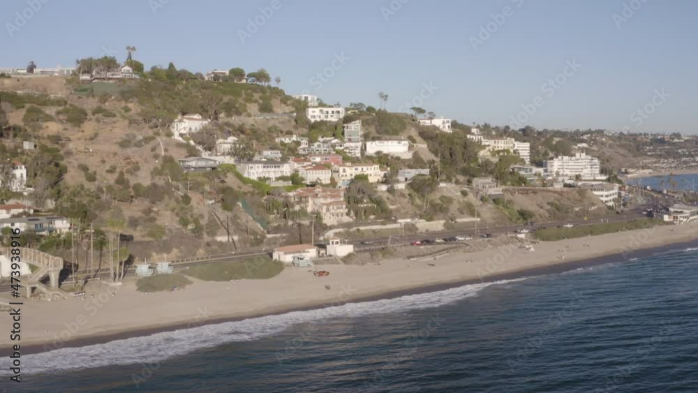 Aerial pull in over the ocean toward the Pacific Palisades Aerial pull in over the ocean toward the Pacific Palisades