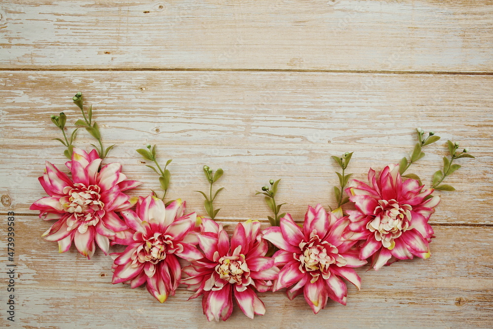 Fototapeta premium Pink Flower bouquet with space copy on wooden background