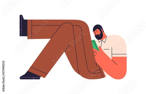 Man relaxing with mobile phone in hands, lying legs crossed and surfing inter...