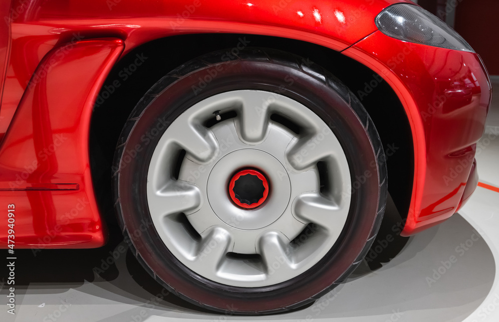 Wheel conceptual red sports car, close up photo