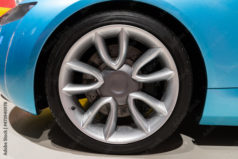 Conceptual blue sports car wheel