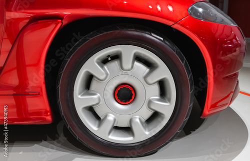 Wheel conceptual red sports car, close up photo