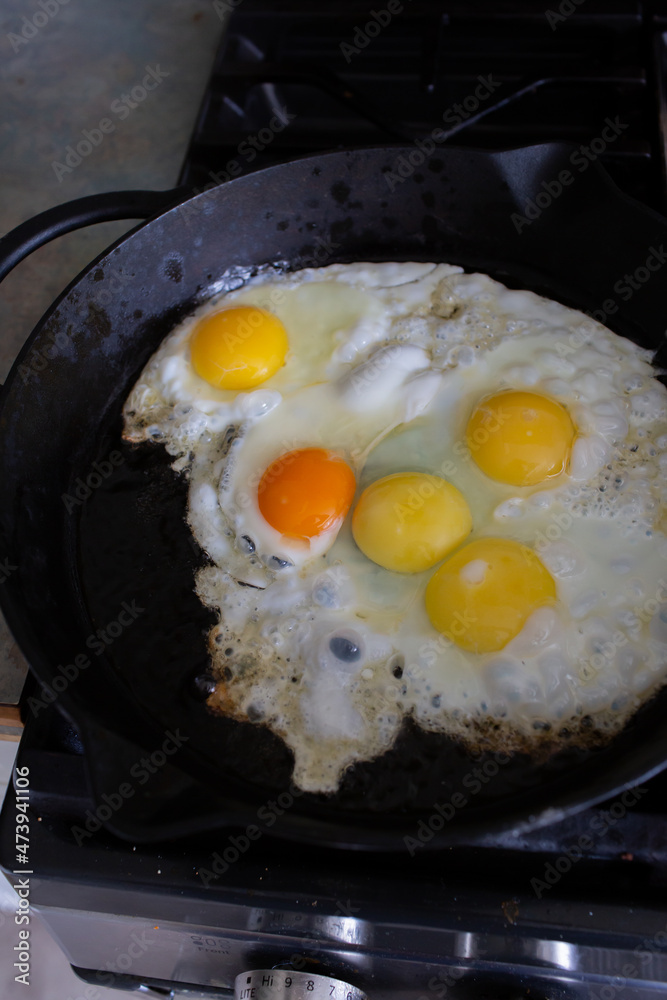 Frying eggs in a cast iron frying pan Frying eggs in a cast iron frying pan