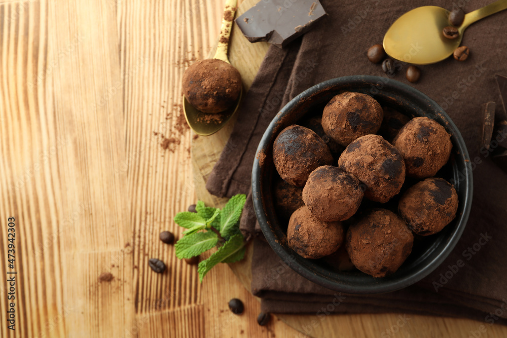 Concept of sweets with truffles on wooden background Concept of sweets with truffles on wooden background