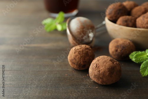 Concept of sweets with truffles on dark wooden background