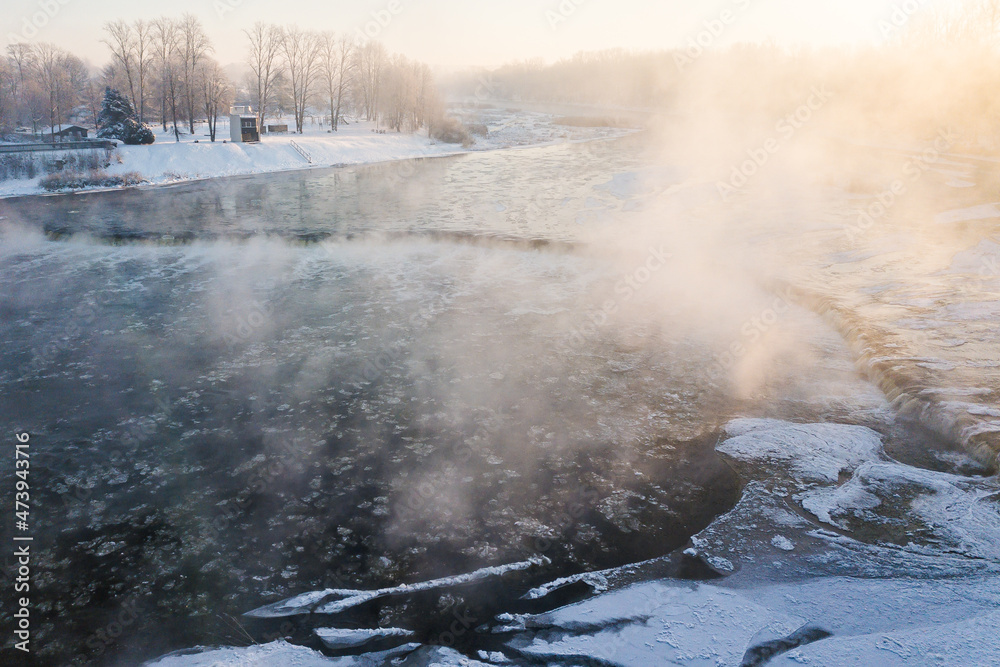 Aerial view of Venta river waterfall, the widest waterfall in Europe in foggy winter day, Kuldiga, Latvia Aerial view of Venta river waterfall, the widest waterfall in Europe in foggy winter day, Kuldiga, Latvia