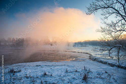 River Venta waterfall in sunny, misty winter morning, Kuldiga, Latvia © Bargais