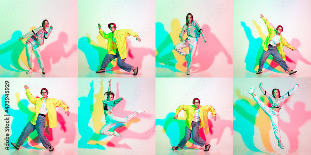 Two stylish girls, teens dancing hip-hop in stylish clothes on colored studio background with glitch effect. Two stylish girls, teens dancing hip-hop in stylish clothes on colored studio background with glitch effect.