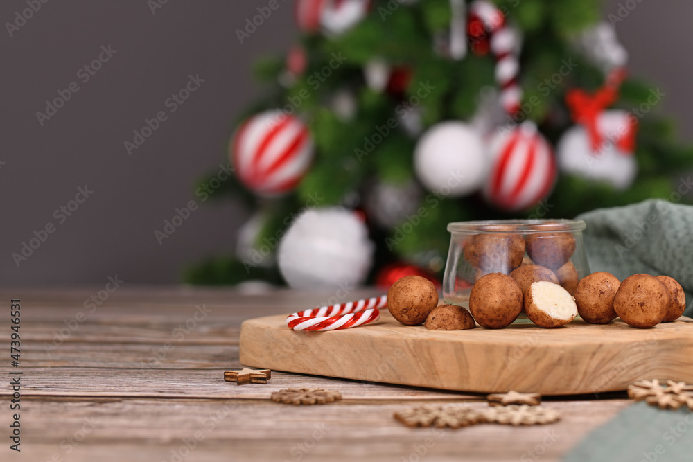 Christmas sweets called 'Marzipankartoffeln'. Round ball shaped almond paste pieces covered in cinnamon and cocoa powder