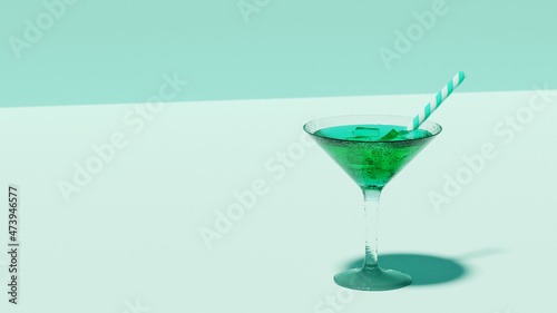 Cocktail vert dans un verre à pied.