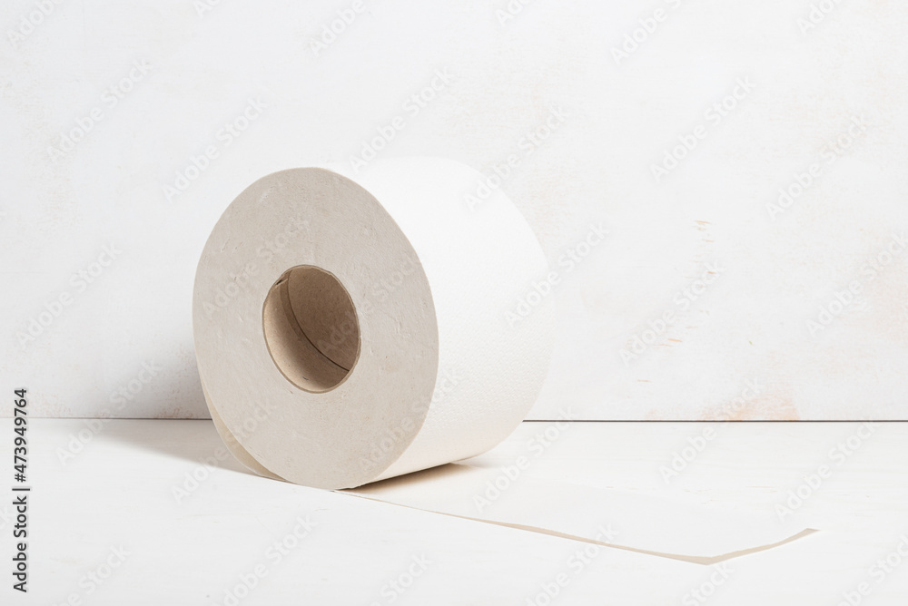 Roll of toilet paper on wooden background, natural, ecological