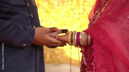 Cinematic shot of a couple holding hands during Muslim wedding in India. photo