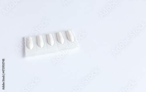 Medical suppositories  vaginal suppositories  rectal suppositories on a white background with copy space
