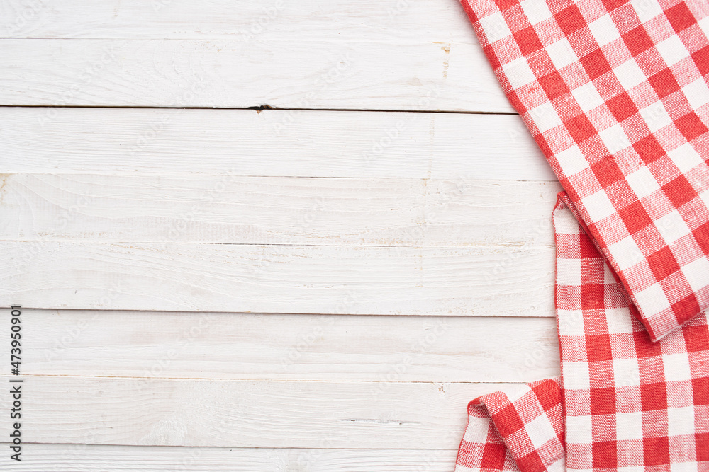 Red checkered tablecloth wooden background texture kitchen decoration Red checkered tablecloth wooden background texture kitchen decoration