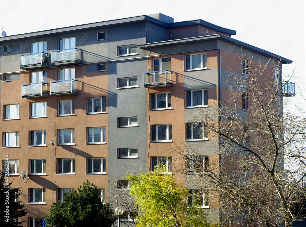 Fototapeta premium Block of flats, urban building, real estate concept. Council tower block. Expensive prices for flats and apartments in the city.