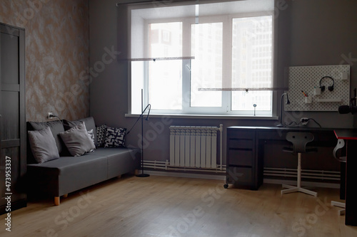 Obraz na płótnie The interior of a teenage boy's room in dark gray and black colors w salonie
