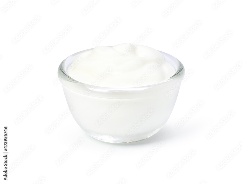 Yogurt or sour cream in glass bowl isolated on white background. Clipping path. Yogurt or sour cream in glass bowl isolated on white background. Clipping path.