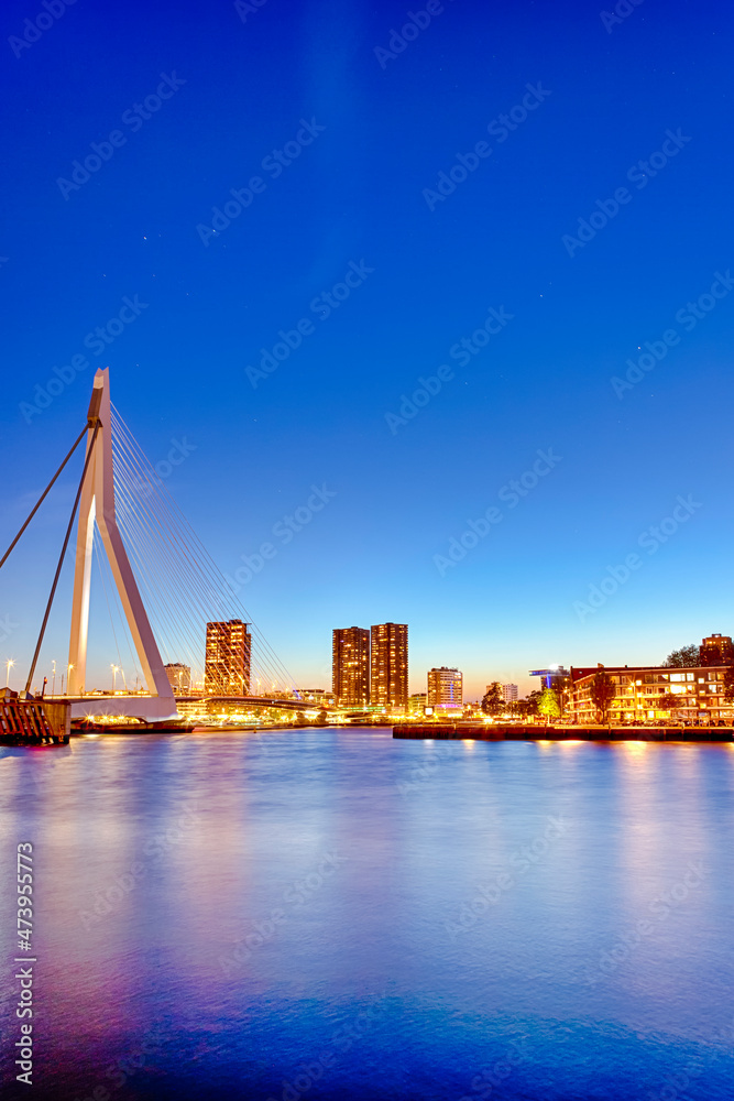 Tranquil Night View of Renowned Erasmusbrug (Swan Bridge) in  Rotterdam in Front of Port with Harbour. Shoot Made At Dusk.