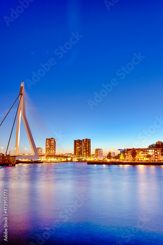 Tranquil Night View of Renowned Erasmusbrug (Swan Bridge) in Rotterdam in Front of Port with Harbour. Shoot Made At Dusk.