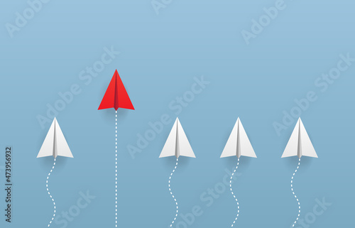 leadership concept with red and white planes on blue sky. Lead airplane stand out of other paper plane follower