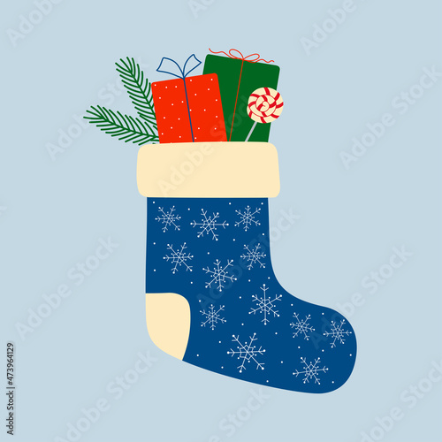 Blue christmas sock with gift boxes, fir branch and candy cane. Christmas winter design element in doodle style.