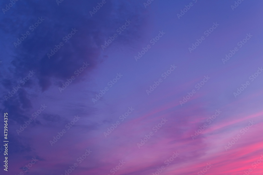 Beautiful sky horizontal background at sunset in purple pink blue color palette - trendy very peri color shade