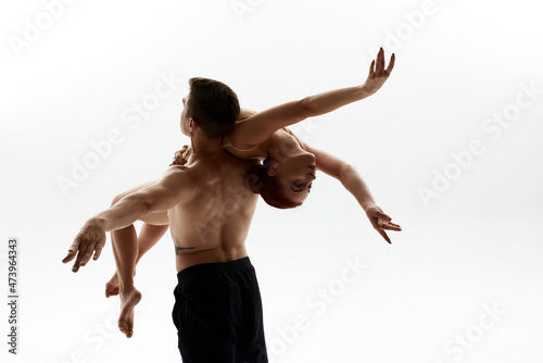 Fototapeta Naklejka Na Ścianę i Meble -  Man holding woman partner during ballet dance