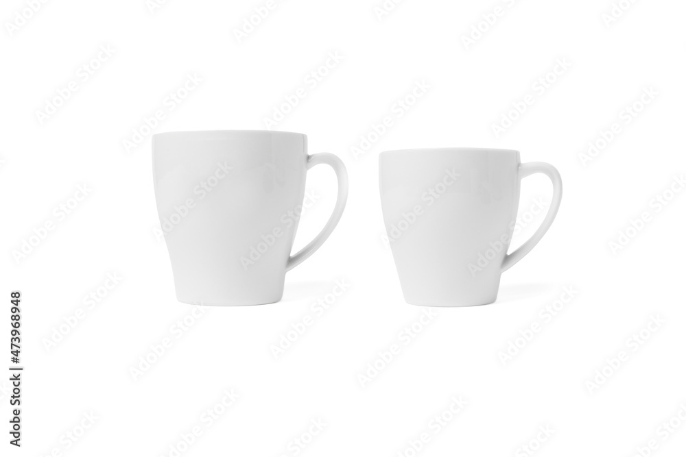 White cup isolated on white background. Ceramic coffee cup or tea mug for drink close up. Mock up classic porcelain utensils White cup isolated on white background. Ceramic coffee cup or tea mug for drink close up. Mock up classic porcelain utensils