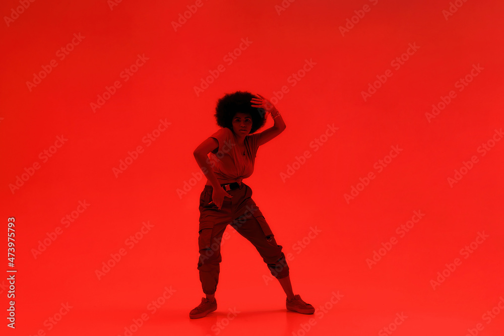 Young black attractive woman dancing hip hop dance Young black attractive woman dancing hip hop dance